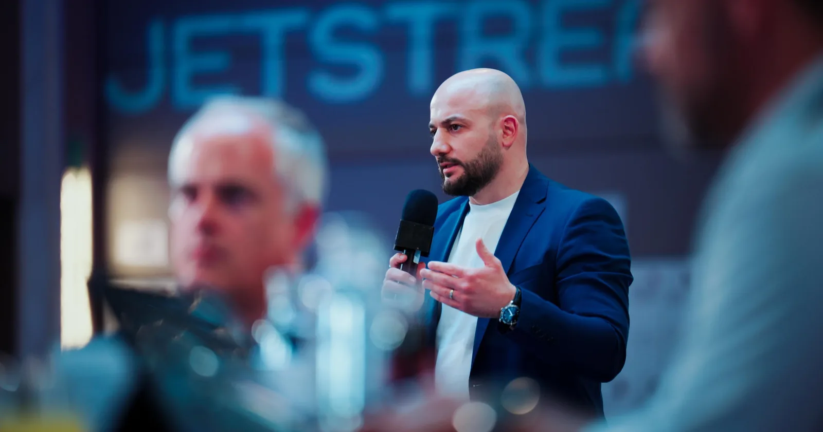 Member speaking into a microphone during a Jetstream meeting